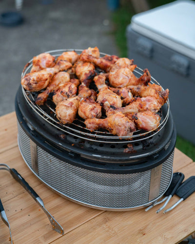 Chicken nibbles on the COBB Grill Supreme portable camping BBQ NZ