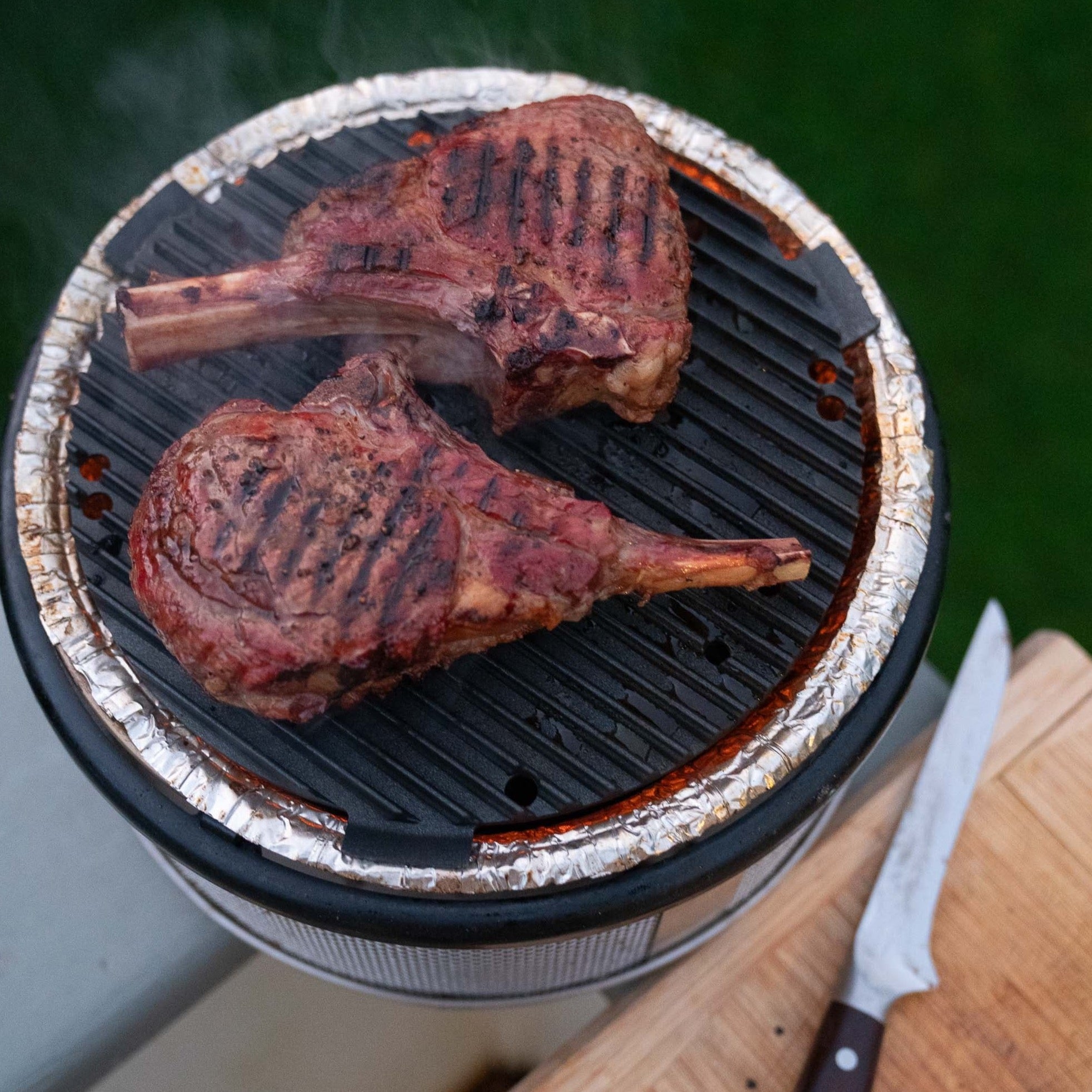 Steaks on the COBB Grill NZ portable BBQ