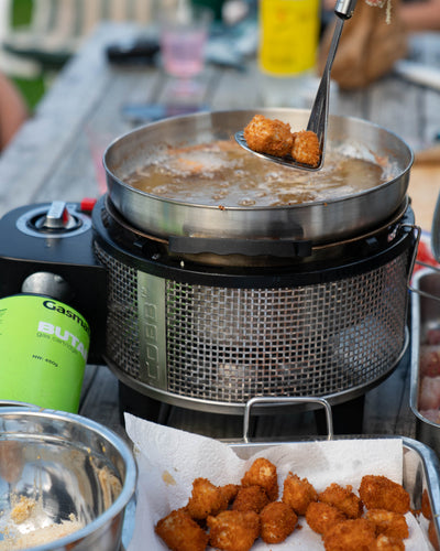 Deep frying in the COBB Grill NZ portable BBQ wok accessory