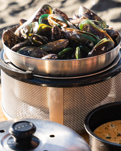 Cooking mussels on the Cobb with the wok accessory